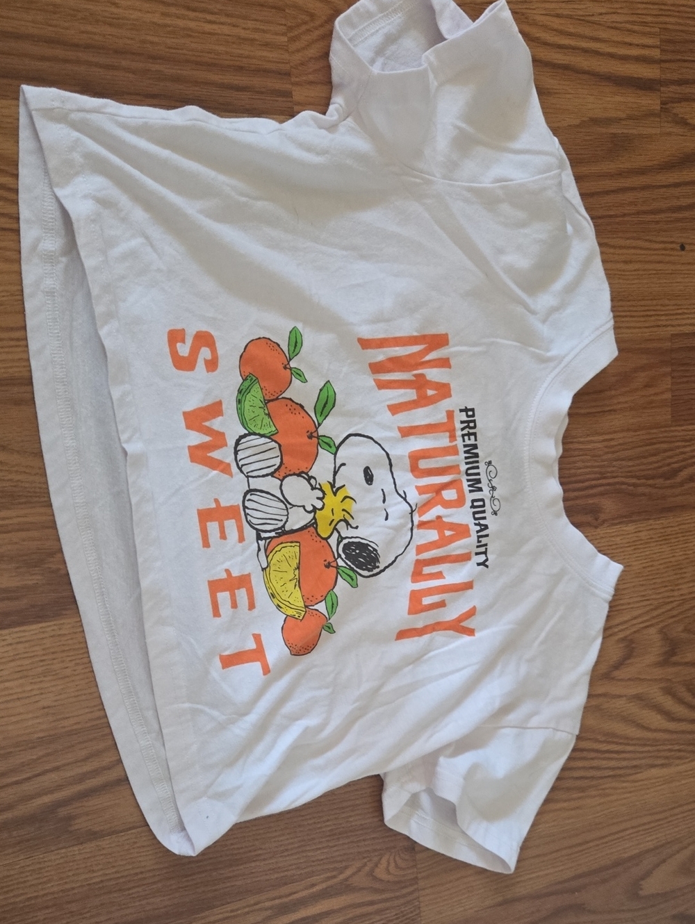 Peanuts White Crop Top with Orange & Green Snoopy Graphic